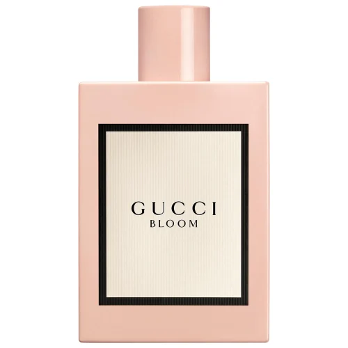Gucci Bloom bočica parfema – minimalistički rumeno ružičasti dizajn sa starinskim šarmom, simbolizujući ženstvenost i prirodnu lepotu