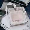 Calvin Klein Euphoria Men EDT parfem u modernom i sofisticiranom ambijentu sa Casio satom i priborom za pisanje