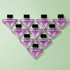 Prada Paradoxe Sweet Chemistry EDP zenski parfem toptaurus.rs Prada Paradoxe Sweet Chemistry parfem sa crnom ribizlom i cvetom narandže, bocice na zelenoj pozadini